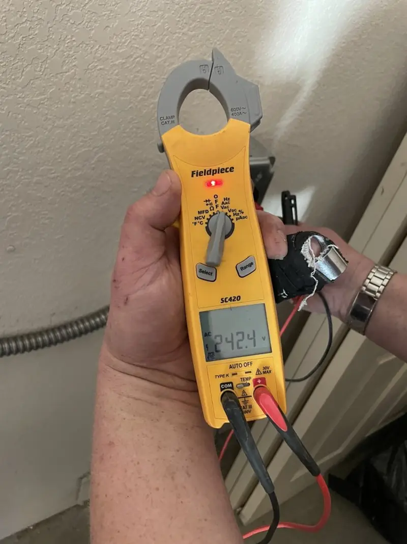 Voltage testing with clamp meter during Aluminum Wiring Replacement in Barling